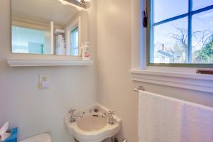 a bathroom with a sink and a toilet and a window at Lake-View Spofford Apartment w/ Shared Dock! in Spofford +16 photos