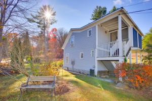 a house with a bench in front of it at Lake-View Spofford Apartment w/ Shared Dock! in Spofford