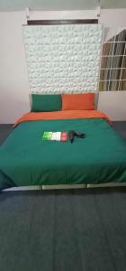 Ένα ή περισσότερα κρεβάτια σε δωμάτιο στο Juan's Mountaintop Lodge