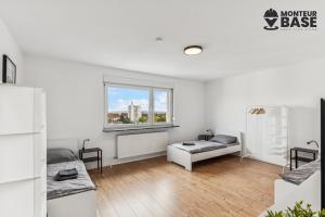 Ένα ή περισσότερα κρεβάτια σε δωμάτιο στο MONTEUR - Unterkunft für bis zu 5 Personen in 63454 Hanau - HU12