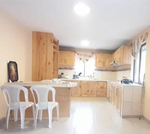 Η κουζίνα ή μικρή κουζίνα στο Colinas de Ricaurte Lodge +5 φωτογραφίες