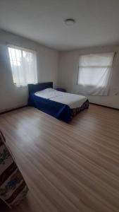 Ένα ή περισσότερα κρεβάτια σε δωμάτιο στο Colinas de Ricaurte Lodge