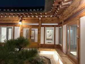 a hallway of a house with wooden walls at seoul hanok stay moonee in Seoul