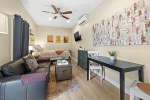 a living room with a couch and a table at Pool and Close to dtwn w2 Bikes in St Petersburg