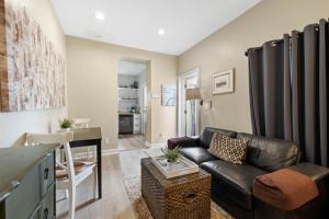 a living room with a couch and a table at Pool and Close to dtwn w2 Bikes in St Petersburg