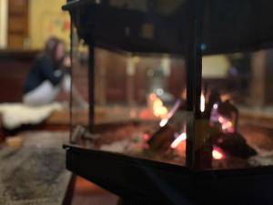 a close up of a fire in a room at Heidi Guest House in Yuzawa
