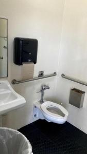 a bathroom with a toilet and a sink at Lakefront Cabin Rental in Bradenton, Florida in Eastgate