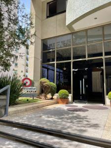 a large building with a large window at Vila da Serra Differential in Nova Lima