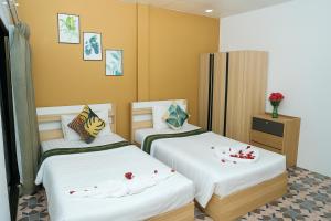 Ένα ή περισσότερα κρεβάτια σε δωμάτιο στο Burning Flame Patong