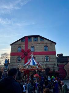 a crowd of people standing in front of a building at Chari's Apartment in Tríkala