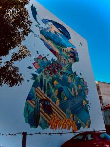 a mural on the side of a building at Chari's Apartment in Tríkala