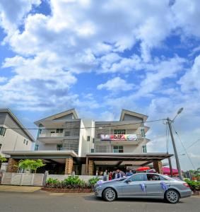 a car parked in front of a building at Palm City Villa in Kuantan