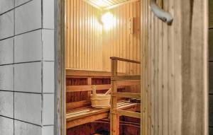 an inside view of a wooden room with a ladder at Amazing Home In Bjärtrå With Sauna in Bjärtrå +21 photos
