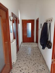 a hallway with a door and a floor with a hallwayngth at La Casa di Anna in Sassari +3 photos