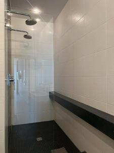 a bathroom with a shower and a sink at Lounge 04 in Norderney