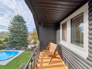 a porch with a chair and a swimming pool at Holiday Home Leisure Lounge & Pool by Interhome in Kvasiny