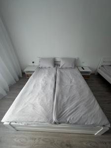 a bed covered in plastic in a room at YarNika in Berehove +6 photos