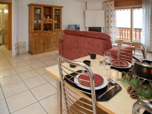 a kitchen with a table with plates on it at Apartment Réze 5 by Interhome in Ovronnaz +18 photos