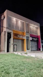 a store front of a building at night at Casa Tulia 2 estadio único in La Plata