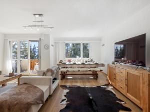 a living room with a couch and a table at Apartment Vermala Soleil B1 by Interhome in Vermala
