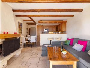a living room with a couch and a table at Apartment Résidence Le Chalet 5 by Interhome in Crans-Montana