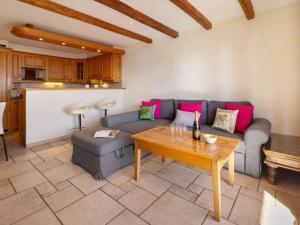 a living room with a couch and a table at Apartment Résidence Le Chalet 5 by Interhome in Crans-Montana +38 photos