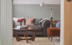 a living room with a couch and a coffee table at No48 - Edwardian Shop Conversion in Pewsey in Pewsey