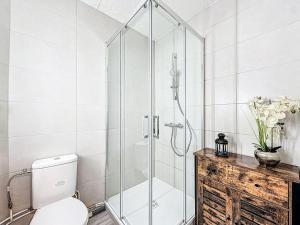 a shower stall in a bathroom with a toilet at Apartment Le Curling B - Val Claret-30 by Interhome in Tignes