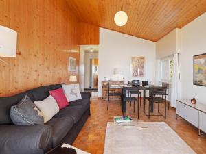 a living room with a couch and a table at Apartment Belmont Est 80 by Interhome in Vermala