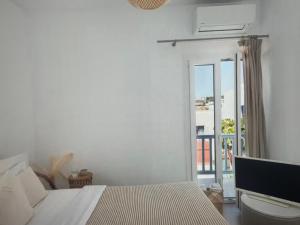 Ένα ή περισσότερα κρεβάτια σε δωμάτιο στο Amazing views in mykonos