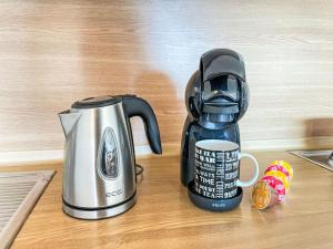 a coffeemaker and a coffee maker on a counter at Apartment Hochstein by Interhome in Haidmühle +8 photos