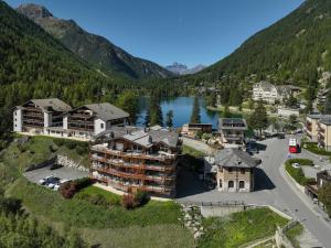 an aerial view of a resort with a river and mountains at Apartment Les Combins 30 by Interhome in Champex