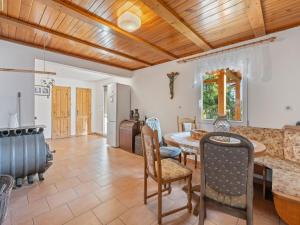 a kitchen and dining room with a table and chairs at Holiday Home Fish & Boat by Interhome in Hurka