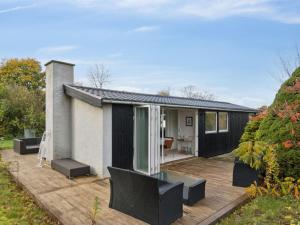 a home with a deck and a house at Holiday Home Gun - 300m to the fjord by Interhome in Glostrup