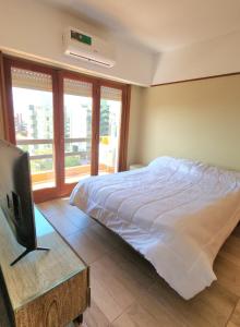 En eller flere senge i et værelse på Arpón