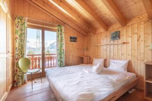Giường trong phòng chung tại Chalet Belle Roche