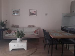 a living room with a couch and a table at Casas da Lameirancha in Mação