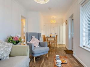 a living room with a couch and a table at 2 Bed in Bacton 75392 in Bacton