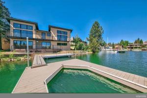 a large house with a large body of water at 2030 Marconi Way home in South Lake Tahoe