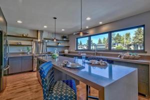 a large kitchen with a large table and chairs at 2030 Marconi Way home in South Lake Tahoe