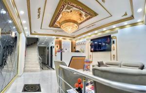 a lobby with a staircase and a ceiling at Hagia Sophia Palace Hotel in Istanbul