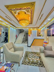 a living room with a couch and a chandelier at Hagia Sophia Palace Hotel in Istanbul