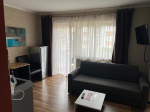 TV a/nebo společenská místnost v ubytování Appartement am Löhner Bahnhof