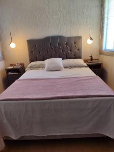 Ένα ή περισσότερα κρεβάτια σε δωμάτιο στο Casa Por do Sol