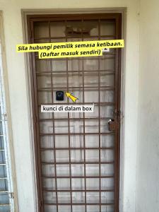 een bordje op de deur van een gebouw bij Private,Glory Beach Resort port dickson-negeri sembilan in Port Dickson