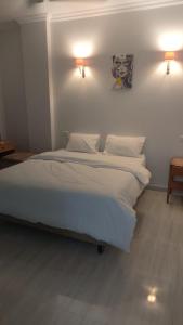 Voodi või voodid majutusasutuse Maat apartment toas