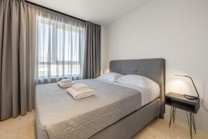 Ένα ή περισσότερα κρεβάτια σε δωμάτιο στο Raise Porta Nuova