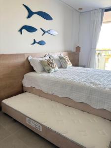 En eller flere senge i et værelse på Beach Class Summer Residence