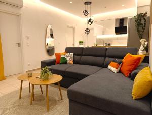 a living room with a couch and a table at Belvedere Luxury Suite in Tríkala