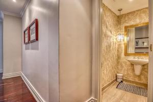 a bathroom with a sink and a mirror at Micheal Angelo towers in Johannesburg +24 photos